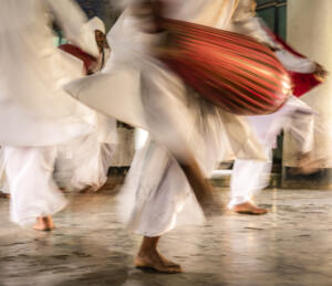 Hindu Vaishnev Dancers with Red Drums • Sally Bucko